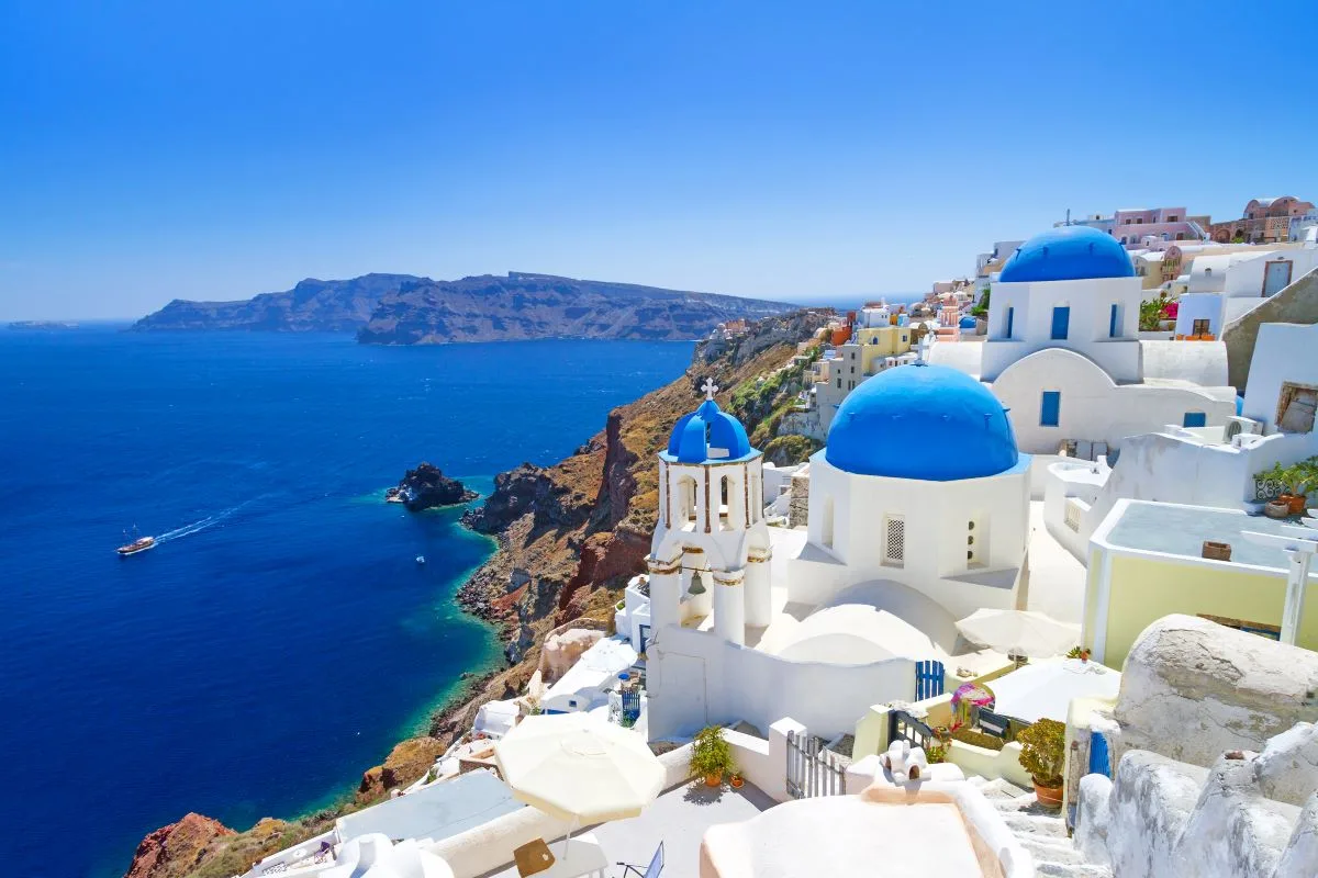 White architecture in typical Greek village by the sea.